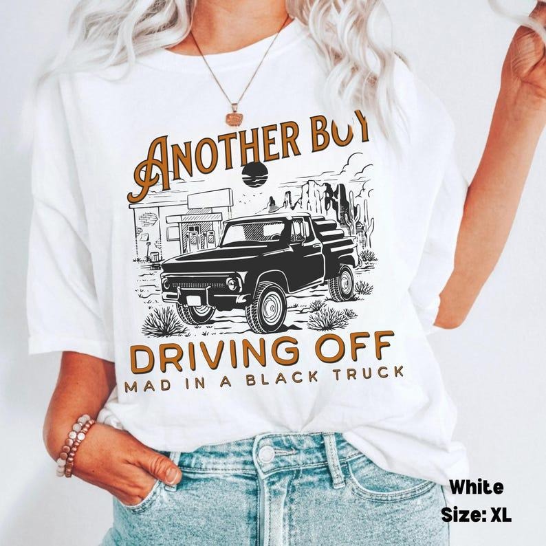 Boy Driving Off Mad Black Truck Shirt, Kelsea Tshirt