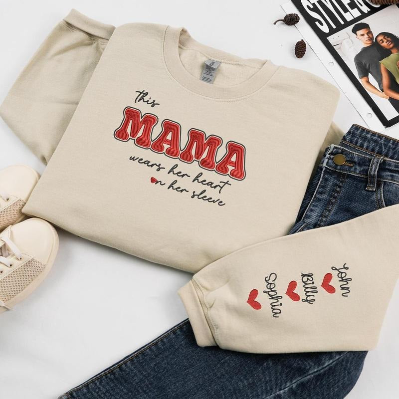 Custom Embroidered This Mama Wears Her Heart on Her Sleeve Hoodie with Kid Name | Mama Valentine Sweatshirt | Valentine Gift For Mom