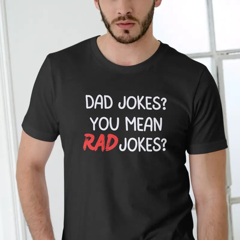 DAD JOKES? YOU MEAN RAD JOKES? Unisex T-Shirt - Black Cotton Fabric with Graphic Text, Soft and Breathable Design for Men