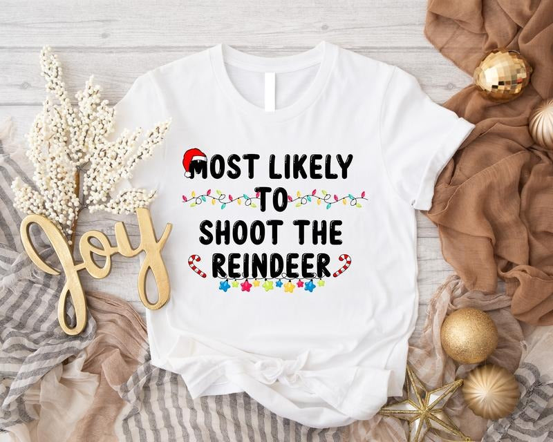 Most Likely To Shoot The Reindeer Shirt, Christmas Hunting T-Shirt, Hunter Funny Christmas Gift Tee, Husband Gift Shirt For Christmas, Christmas Light Tee.