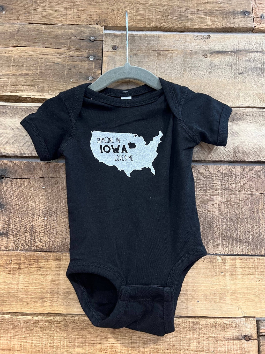 Someone in Iowa Loves Me (Black) Onesie