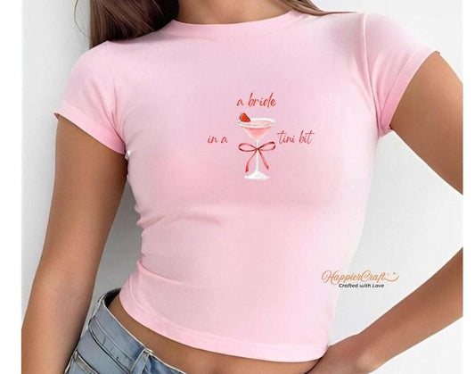 A Bride In A Tini Bit Bachelorette Baby Tee, Y2k Trending Bachelorette Party Baby Tee, Bride To Be Shirt Bridal Party Gift, Wedding gift