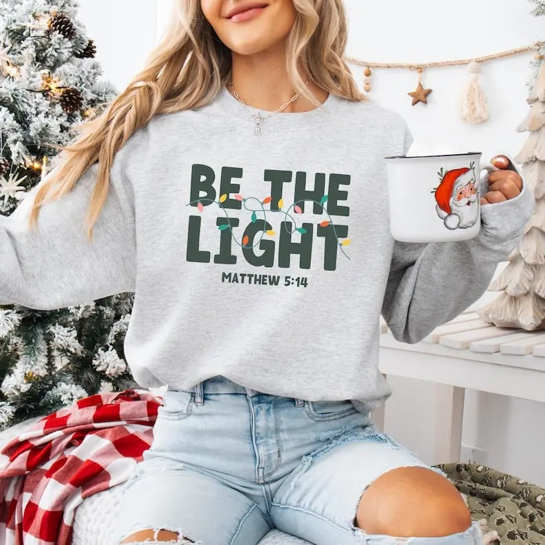 Be The Light Sweatshirt, Religious Christmas Sweatshirt, Christian Holiday Sweater, Faith Based Gift, Christmas Gifted,...