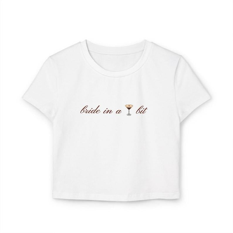 Bride in a Tini Bit Women's Baby Tee (Espresso Martini) Hoodie, Sweatshirt | DripVista.com
