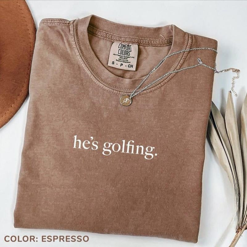 Comfort Colors He's Golfing Shirt, Golfing Season T-Shirt, Golfer Wife Shirt, Golf Lover Tee, Golfing Mom TShirt, Golf Player Shirt for Mom