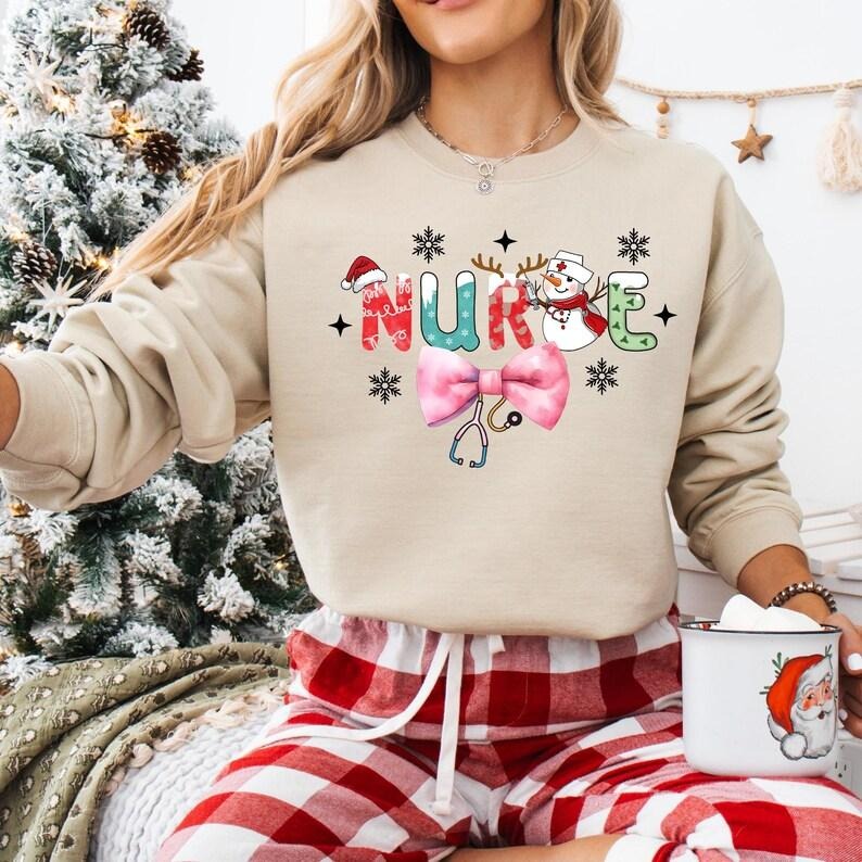 Coquette Bow Nurse Christmas Sweatshirt, Funny Santa Nurse T-shirt, ICU ER Rn Nurse Tee, Christmas Nurse Life Hoodie,...