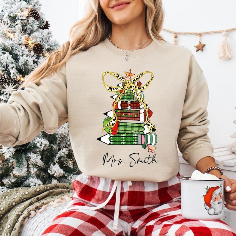 Coquette Bow Pencil Teacher Christmas Shirt, Custom Name Teacher Sweatshirt, Very Merry Teacher T-shirt, Santa's Favorite...