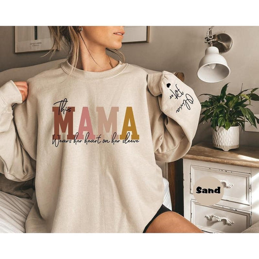 Custom This Mama Wears Her Heart On Her Sleeve Hoodie, Personalized Mom Sweatshirt With Kids Names, Cute Momma Outfit, Mothers Day Gifts