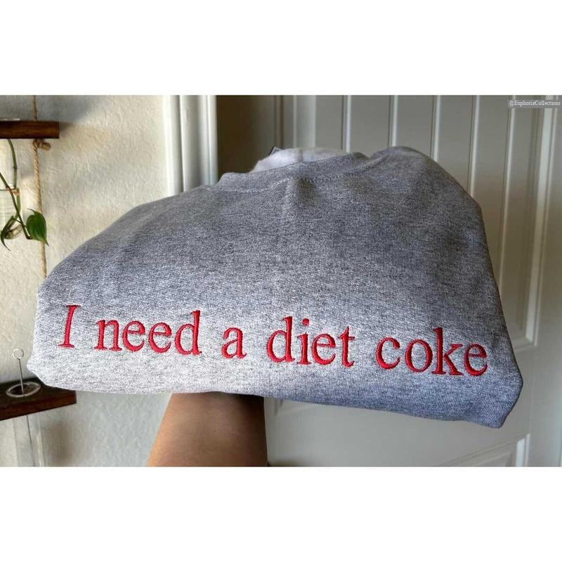 Embroidered I Need a Diet Coke Unisex Sweater, Hoodie, Tee, Diet Coke Lover Cringe Meme Funny Gift , Global Trending...