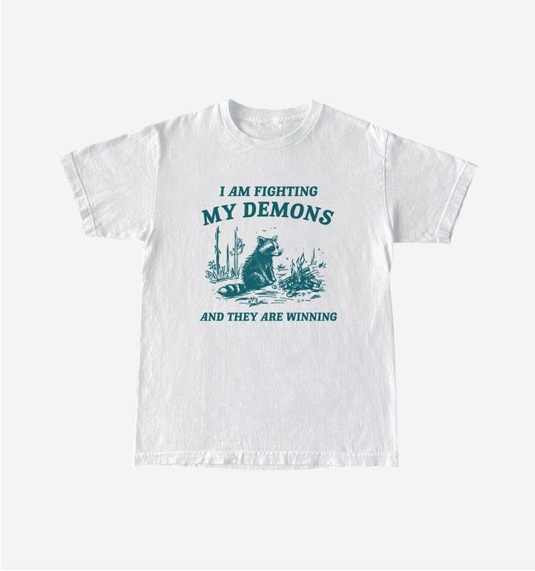 Funny Meme Shirt, I Am Fighting My Demons Tee, Raccoon Gift Unisex T-Shirt Hoodie, Sweatshirt | DripVista.com