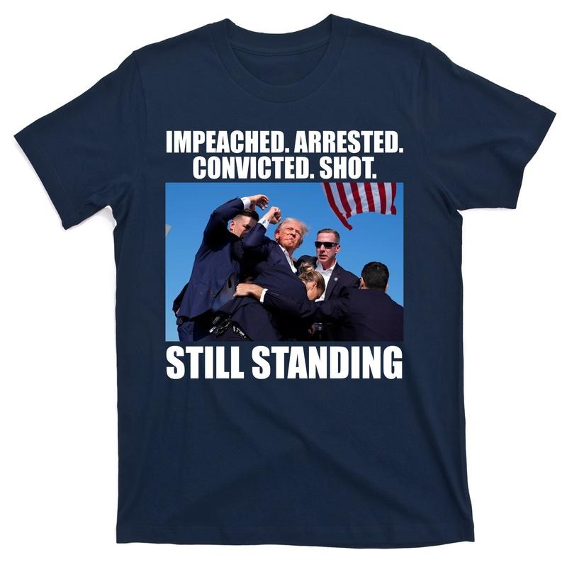 Impeached Arrested Convicted Shot Still Standing Donald Trump T-Shirt Hoodie, Sweatshirt | DripVista.com