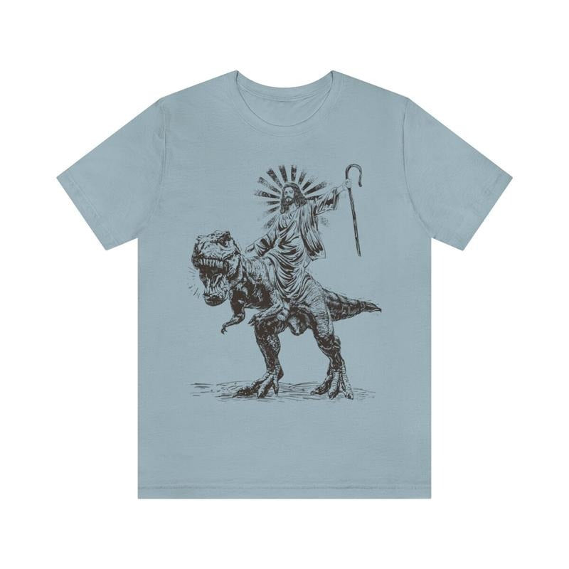 Jesus Riding T rex Dinosaur Shirt | Jesus T-shirt | Wild Dinosaur Sweatshirt Hoodie | DripVista.com