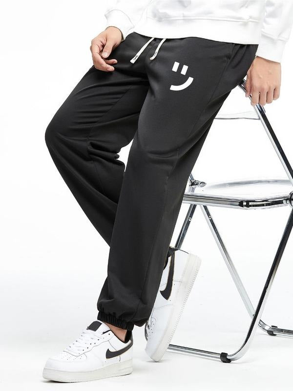Men'WB shield Cartoon TNF Print Drawstring Waist Jogger Pants, Casual Comfortable Slim Elastic Waist Trousers for Daily...