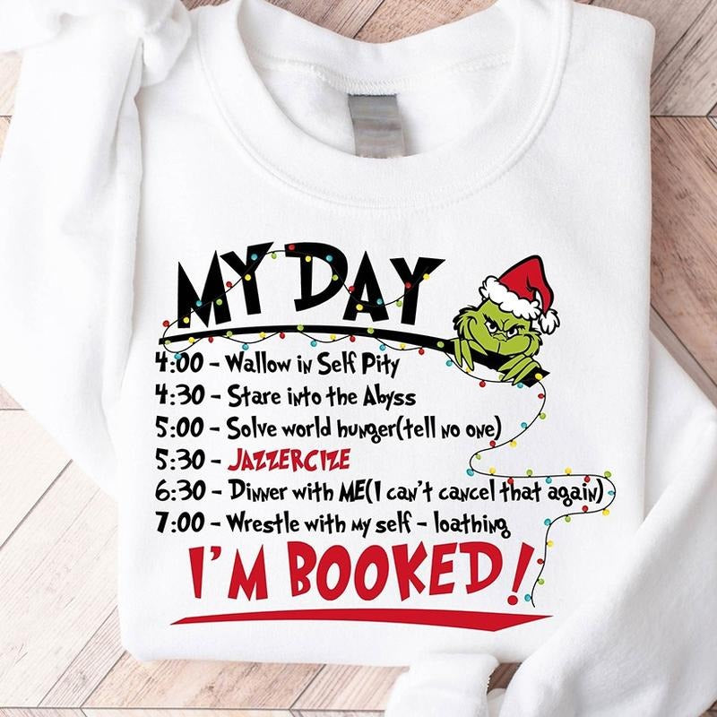 My Day I'm Booked Grinch Christmas Crewneck Sweatshirt, Hoodie, T-shirt | DripVista.com