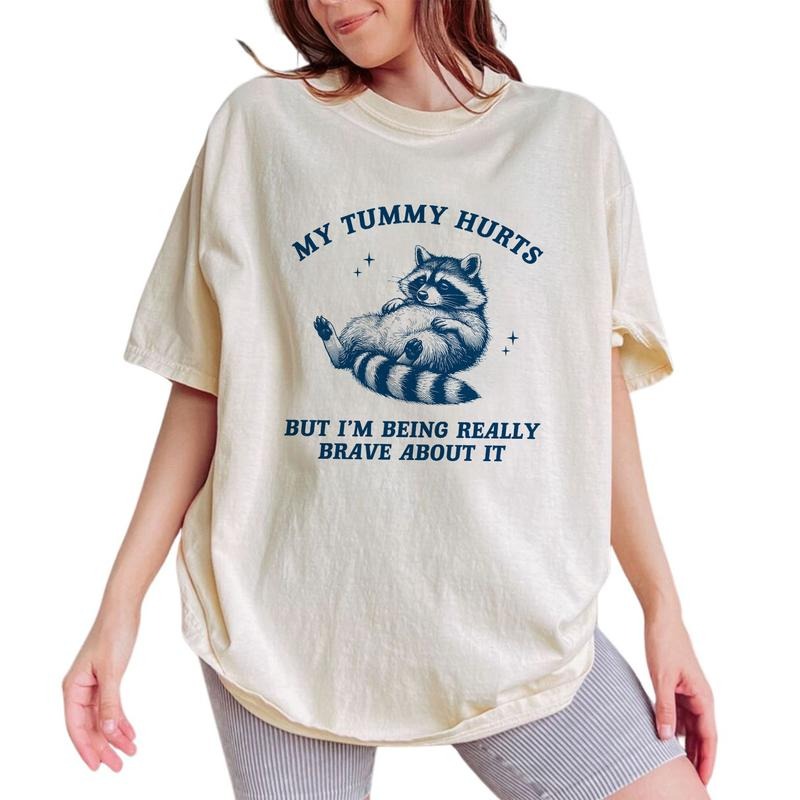 My Tummy Hurts But I'm Being Very Brave About It Shirt, Meme Shirt, Funny 90s Retro Raccoon Cotton Fabric T-shirt, Weird T Shirt For Women, Raccoon Gifts, Raccoon Lovers Tops Womenswear Relaxed Fit Chic Style, Vintage Animal Graphic Printed Shirt Outfits
