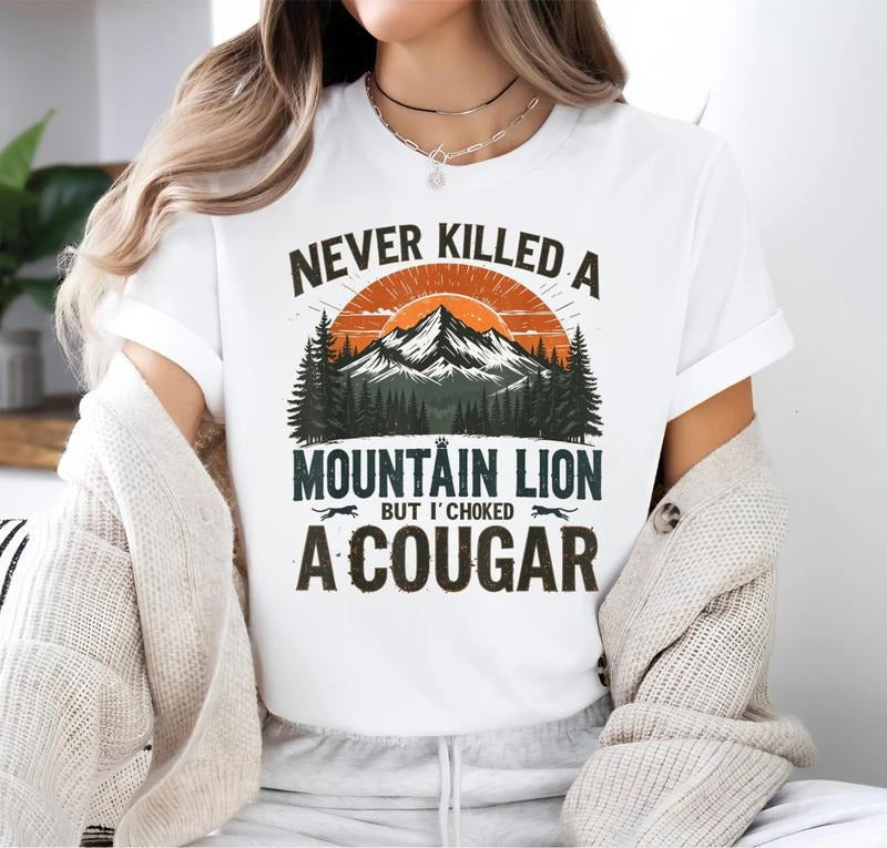 Never Killed WB shield Mountain Lion But Swoosh'Superhero team Choked WB shield Cougar quotes T-Shirt, 100% cotton...