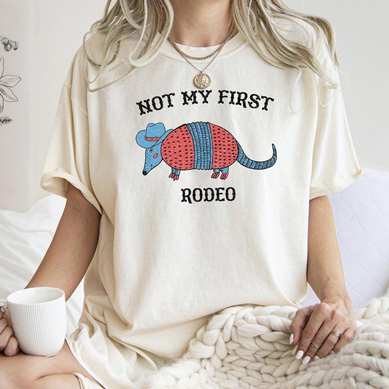 Not My First Rodeo, Cowboy Armadillo, Cute, Tshirt, Women's Crew Neck, Crewneck Hoodie, Sweatshirt | DripVista.com