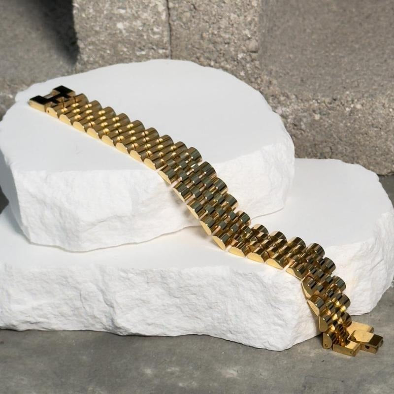 Roly Statement Bracelet - Gold-Toned Design on White Surface Product Image T-Shirts, Hoodie, Sweatshirt | DripVista.com
