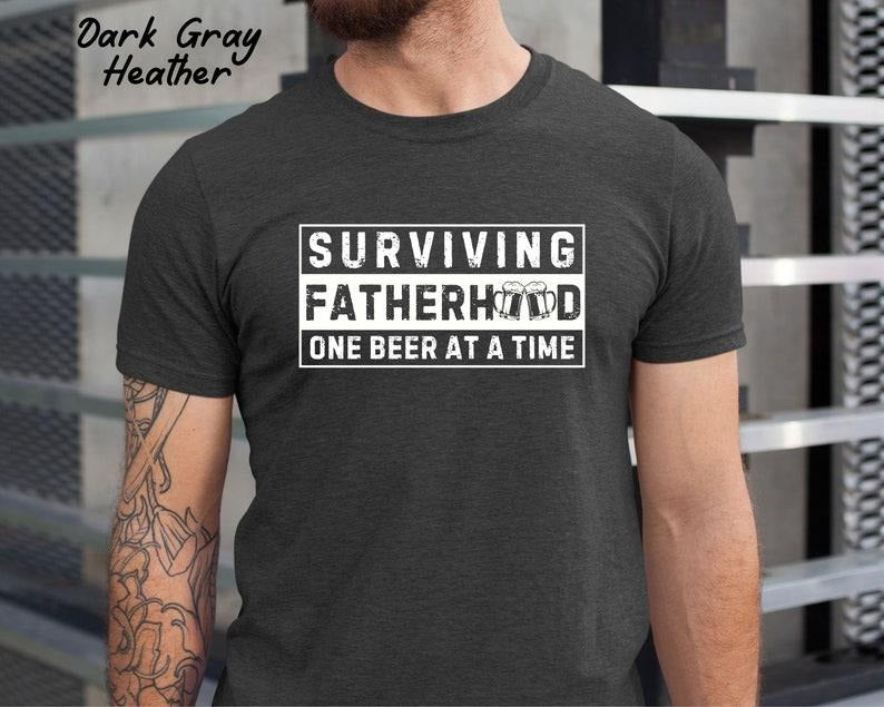 Surviving Fatherhood One beer at a time Dad Shirt/T-shirt/Hoodie/Sweater, Funny Dad Shirt, New Dad T shirt, Father's Day Gift, Gift For Husband, Dad Life Shirt