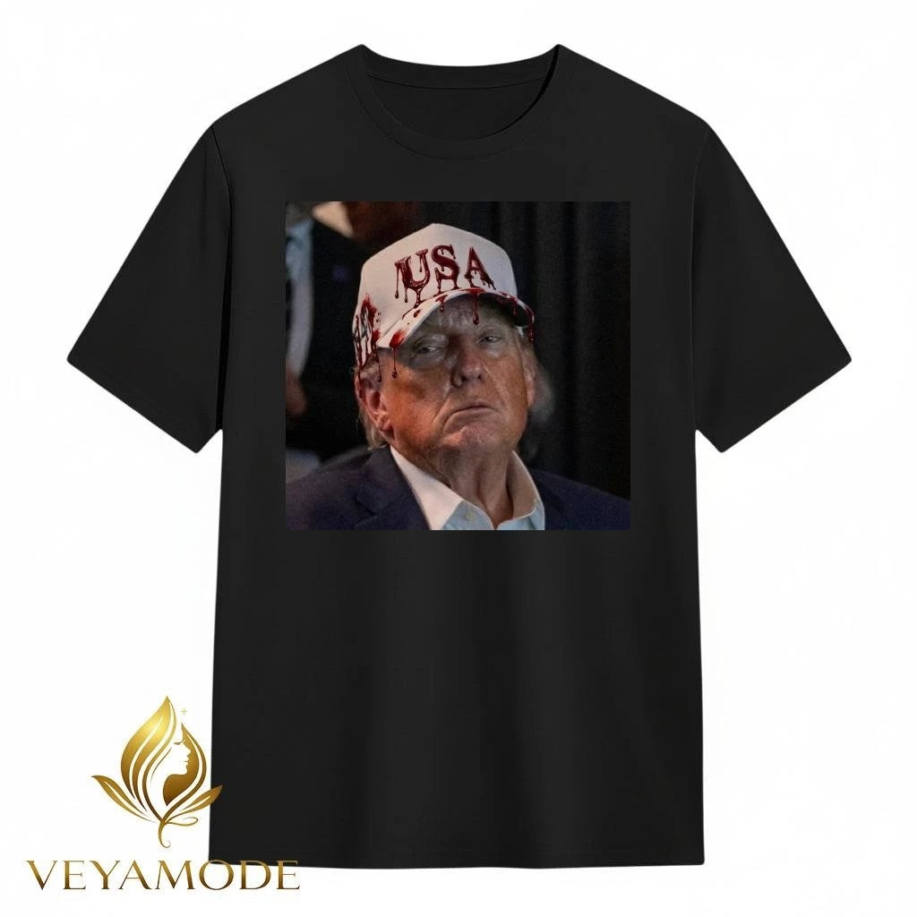 Trump wears a blood-red USA hat tee
