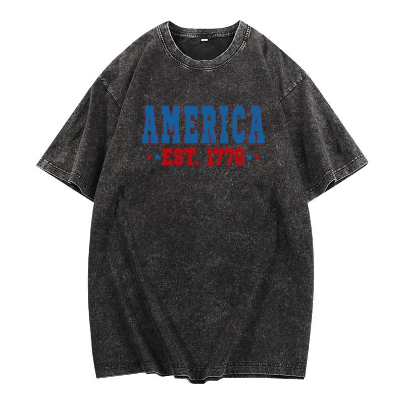 Washed - effect American Heritage Tribute Tee: Celebrate America'WB shield Founding with WB shield Bold "America EST....