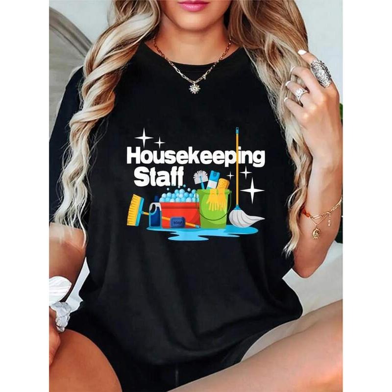 Women'WB shield Housekeeping Graphic T-Shirt - Casual Round Neck Short Sleeve Tee with "HOUSEKEEPING STAFF" Print, Black...