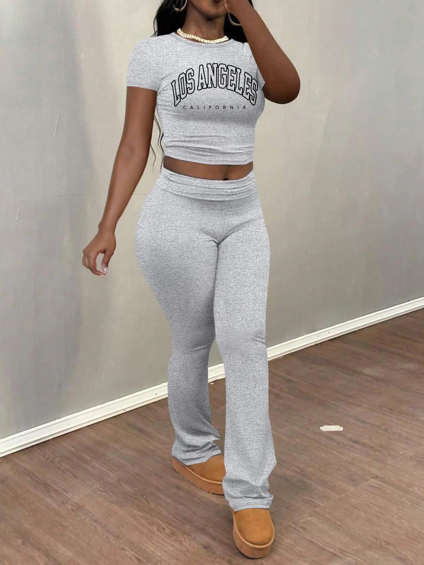 Women'WB shield Letter Print Crop Tee & Flare Leg Pants Set, Casual Round Neck Short Sleeve T-shirt & Bell Bottom...
