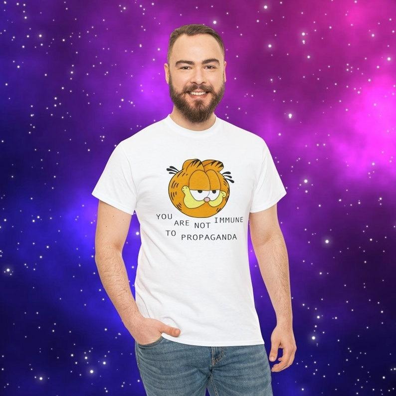 You Are Not Immune To Propaganda Shirt | Garfield You Are Not immune to Propaganda shirt Hoodie, Sweatshirt | DripVista.com