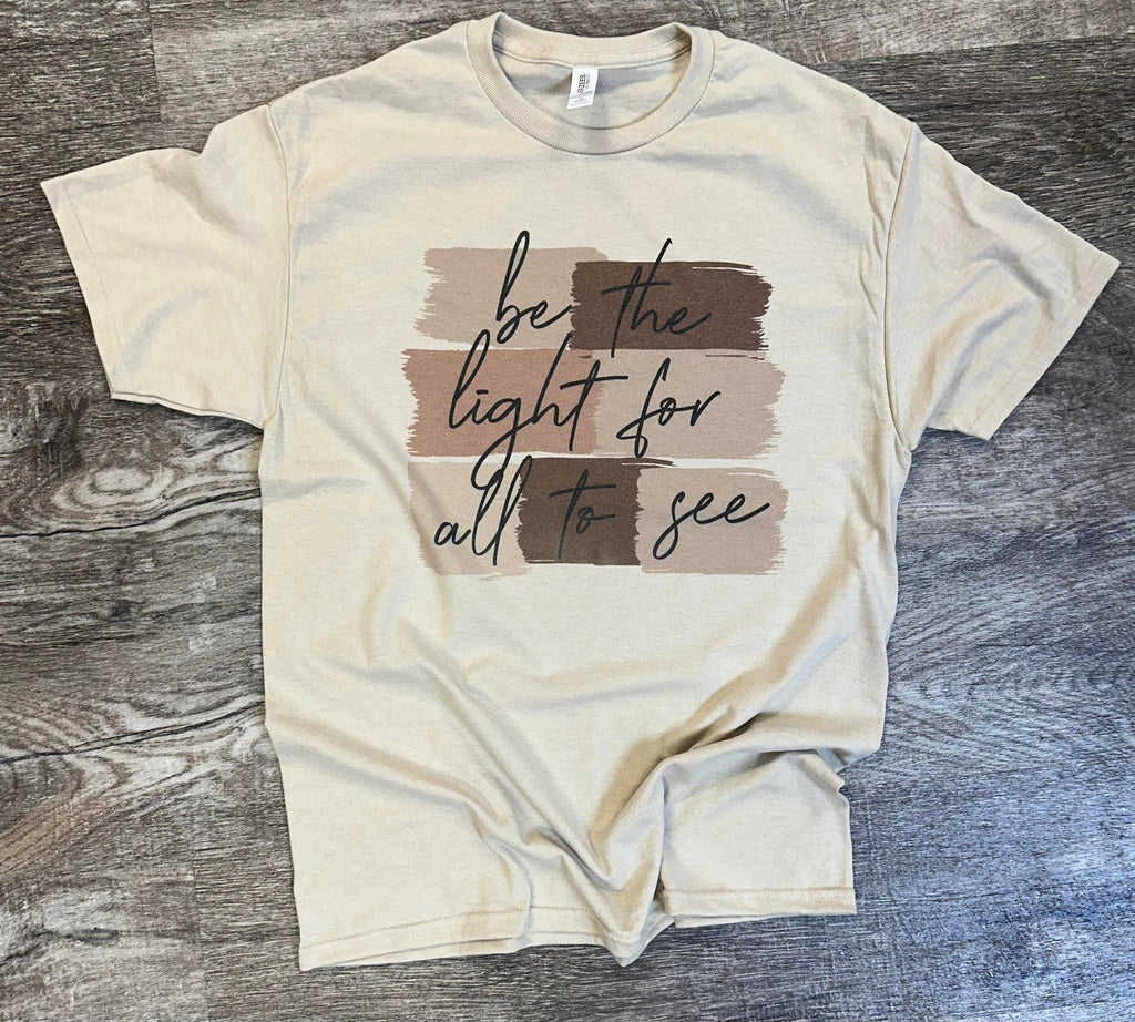 Be the Light For All To See On Sand Tee