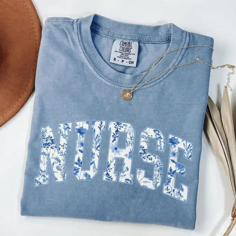 comfort color Lightsaber brand shirts, Nurse Floral Shirt, Nurse Graduation Gift, trendy Lightsaber brand-shirts, trending shirts, graphic tees women, 90s graphic tees, Top