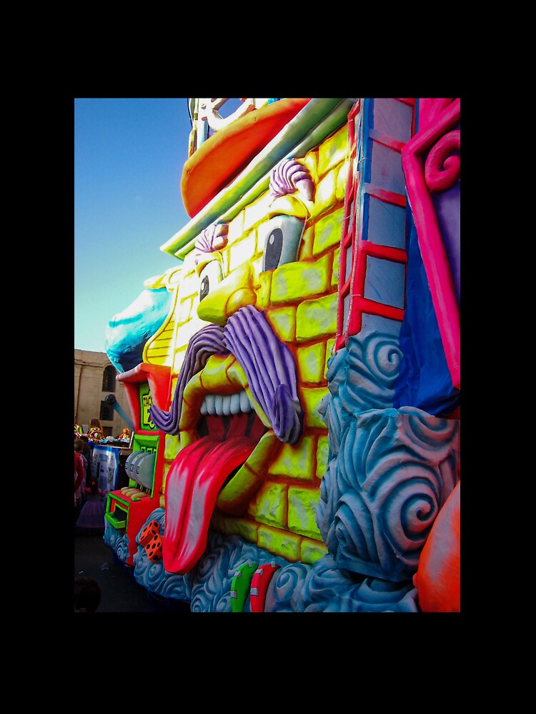 Colorful Carnival Parade Float With Giant Cartoon Face Tongue Out And Purple Mustache by Nmallia